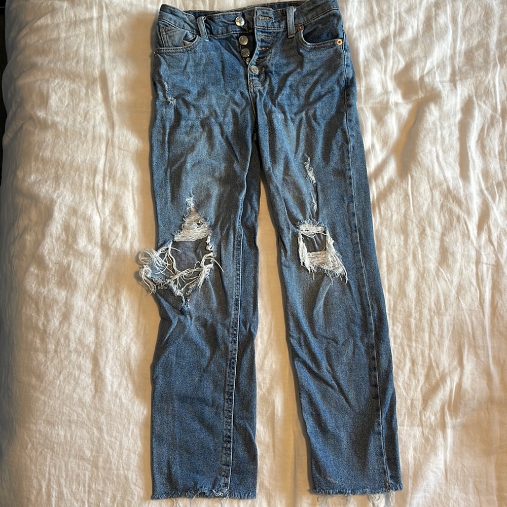 Dark wash “Mom Style” ripped jeans. Ankle length.